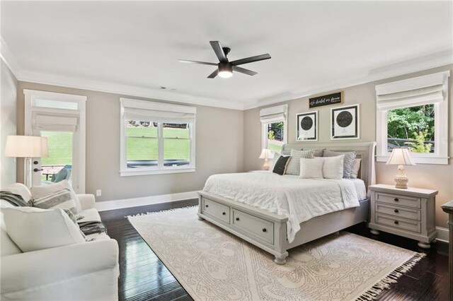 bedroom featuring ornamental molding, ceiling fan, and dark hardwood / wood-style flooring