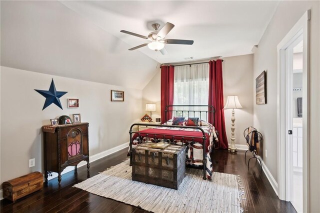 bedroom featuring ceiling fan, dark wood-type flooring, and vaulted ceiling