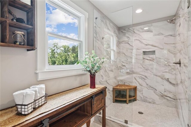 bathroom with tiled shower