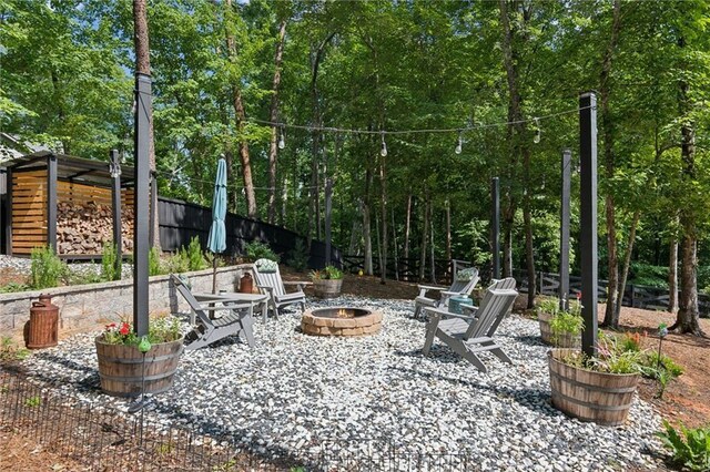 view of patio / terrace featuring an outdoor fire pit