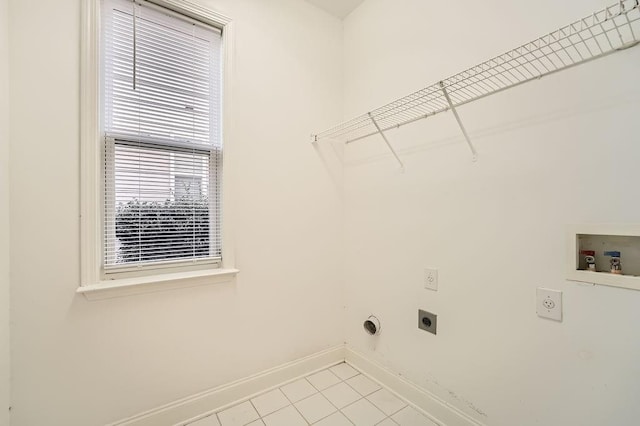 washroom with laundry area, light tile patterned floors, baseboards, hookup for an electric dryer, and washer hookup