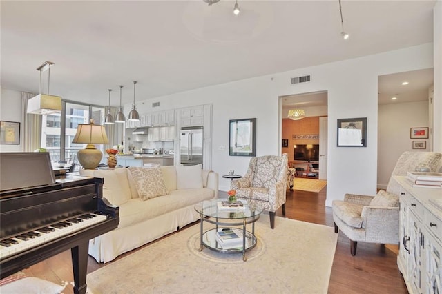 1820 Peachtree St NW Unit 1008, Atlanta, GA 30309 - living room with dark wood-style floors and baseboards
