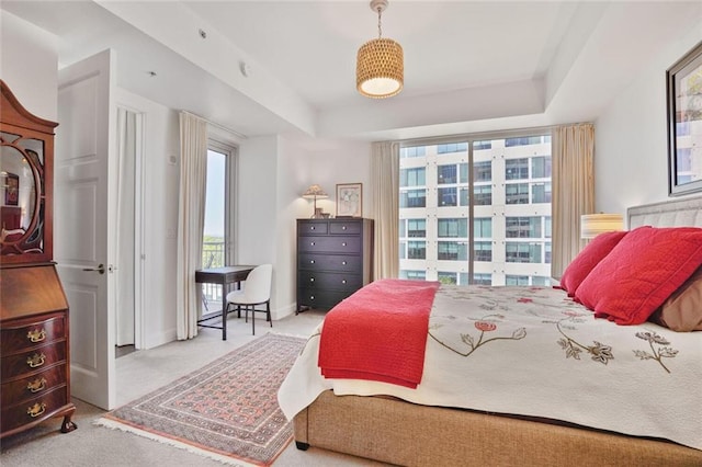 1820 Peachtree St NW Unit 1008, Atlanta, GA 30309 - carpeted bedroom with baseboards and a tray ceiling