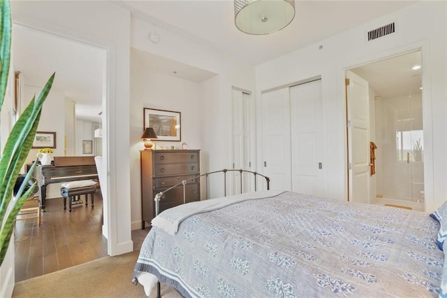 1820 Peachtree St NW Unit 1008, Atlanta, GA 30309 - bedroom with carpet flooring, ensuite bathroom, and baseboards