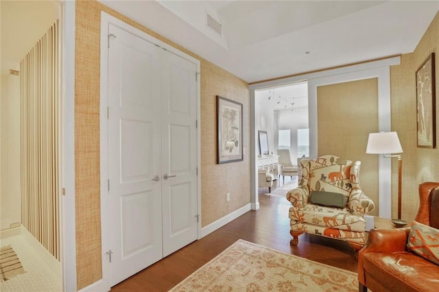 1820 Peachtree St NW Unit 1008, Atlanta, GA 30309 - living area featuring wallpapered walls, dark wood-type flooring, and baseboards