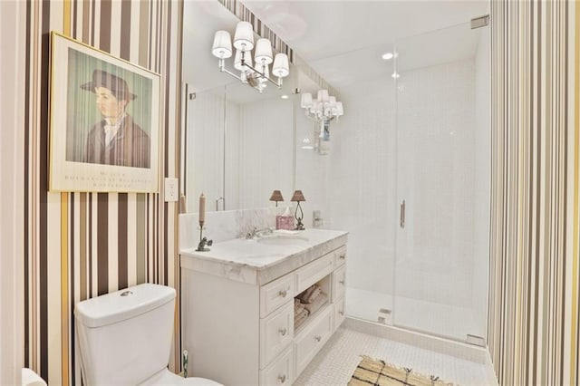 1820 Peachtree St NW Unit 1008, Atlanta, GA 30309 - bathroom featuring wallpapered walls, toilet, double vanity, a stall shower, and tile patterned floors