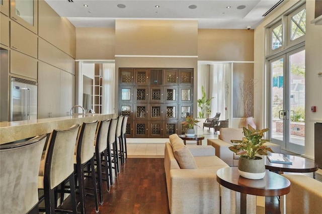 1820 Peachtree St NW Unit 1008, Atlanta, GA 30309 - living room with a towering ceiling and dark wood-type flooring