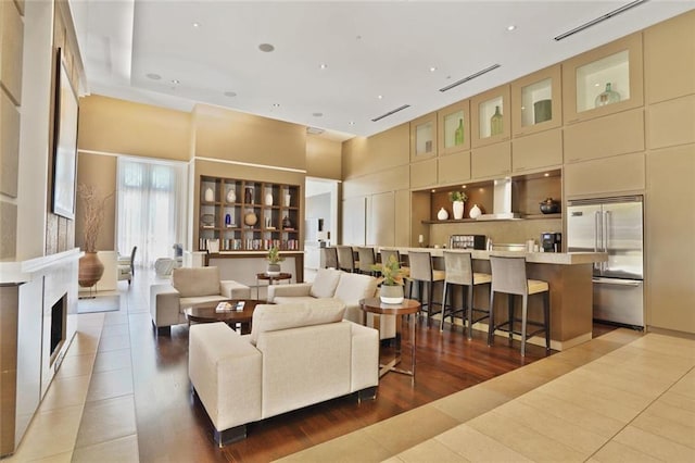 1820 Peachtree St NW Unit 1008, Atlanta, GA 30309 - living area featuring tile patterned flooring, a towering ceiling, and recessed lighting