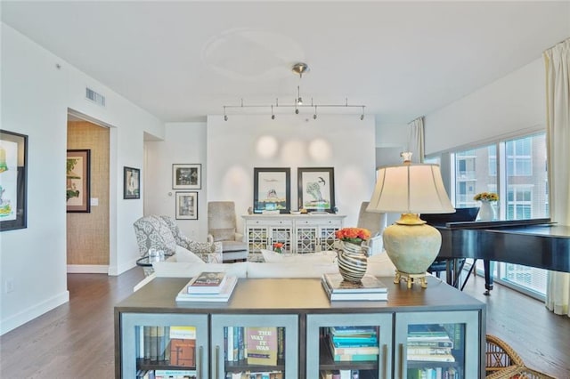 1820 Peachtree St NW Unit 1008, Atlanta, GA 30309 - living area featuring baseboards, wood finished floors, and rail lighting