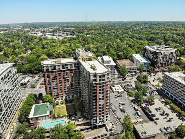 1820 Peachtree St NW Unit 1008, Atlanta, GA 30309 - drone / aerial view of a pool and a heavily wooded area