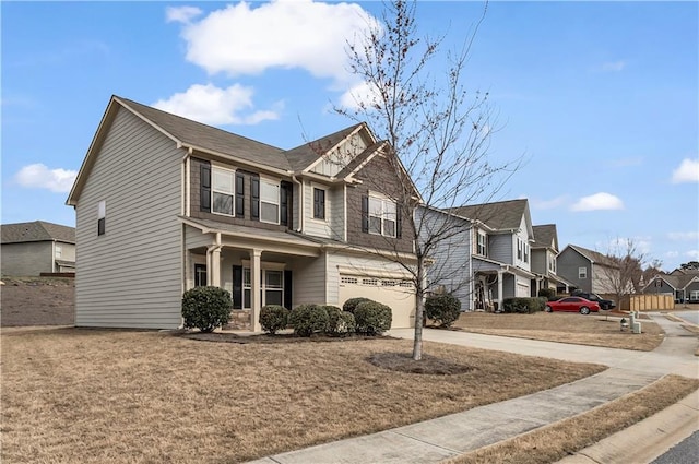 view of front of house featuring driveway, an attached garage, and a residential view