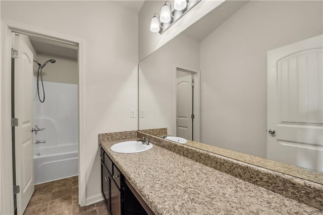 bathroom featuring shower / bath combination, vanity, and baseboards