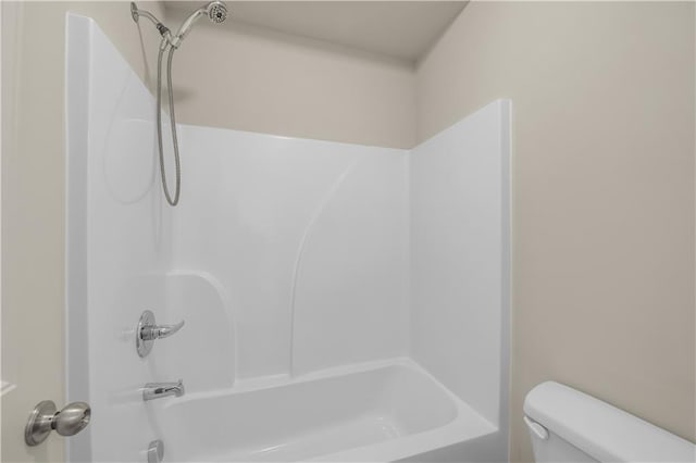 full bathroom with shower / bath combination and toilet