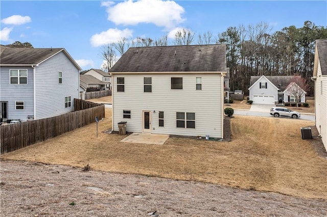 back of house featuring a patio area, fence, and central AC