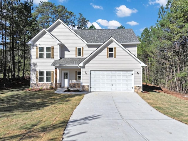 view of front facade featuring a garage, a front lawn, and a porch