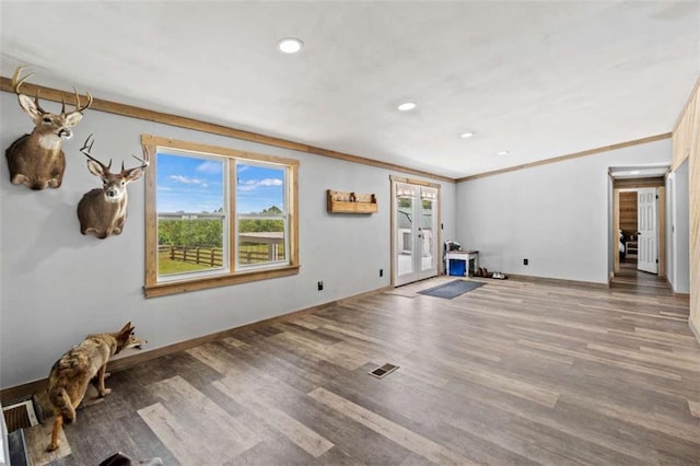 437 Crabapple Rd, Dahlonega, GA 30533 - unfurnished living room featuring french doors, wood finished floors, recessed lighting, and ornamental molding