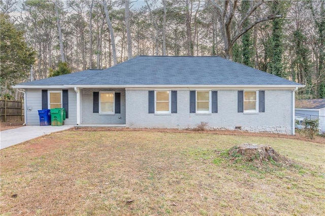 single story home featuring brick siding, crawl space, a front yard, and fence