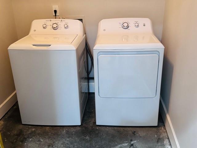 384 Ralph Mcgill Blvd NE Unit 121, Atlanta, GA 30312 - laundry room with separate washer and dryer, baseboards, and laundry area