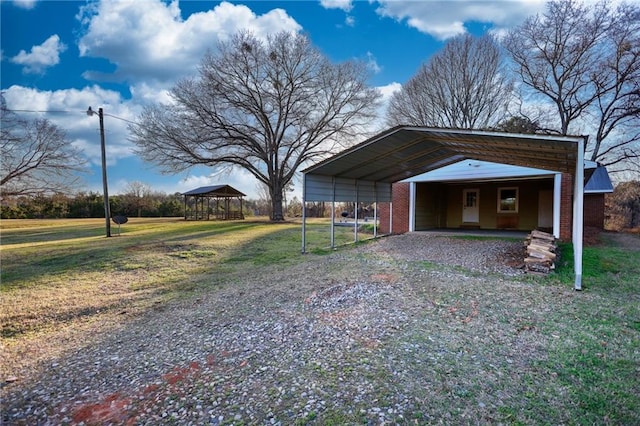 exterior space with gravel driveway