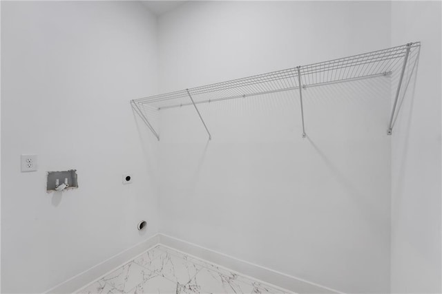 washroom with laundry area, baseboards, marble finish floor, and electric dryer hookup