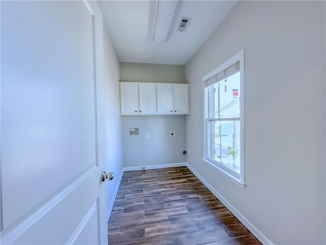 3780 Baxley Pine Trl, Suwanee, GA 30024 - laundry room with cabinet space, electric dryer hookup, dark wood finished floors, and hookup for a washing machine