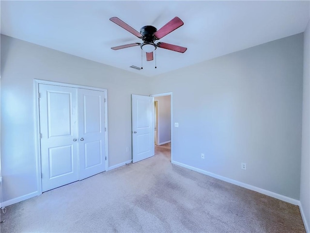 3780 Baxley Pine Trl, Suwanee, GA 30024 - unfurnished bedroom with carpet, a closet, and a ceiling fan