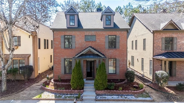 view of front of property featuring brick siding