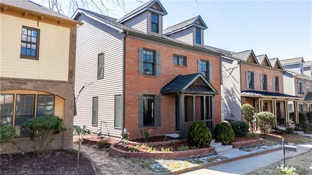 view of front of property featuring brick siding