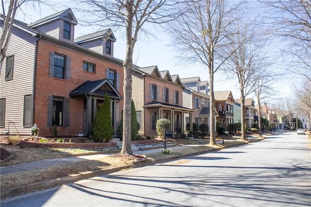 exterior space with brick siding and a residential view