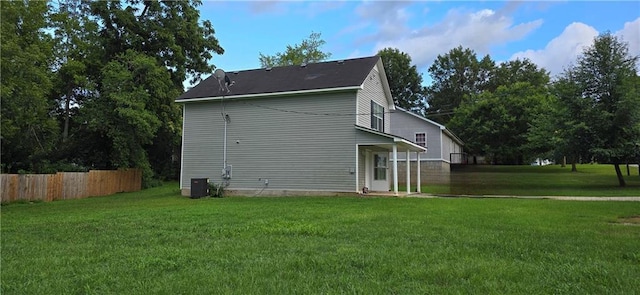 back of house with a yard