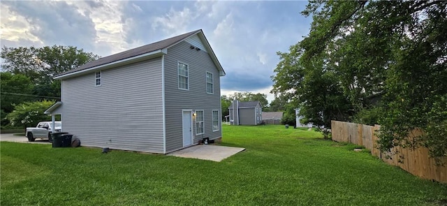 view of side of property with a lawn