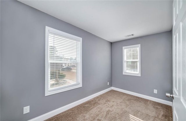 empty room featuring light colored carpet