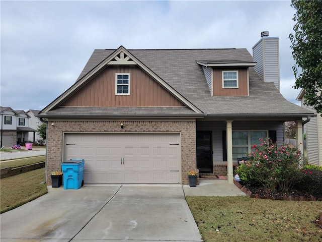 craftsman-style house with a front yard and a garage