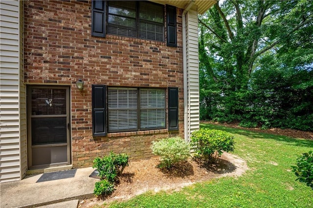 entrance to property with a yard