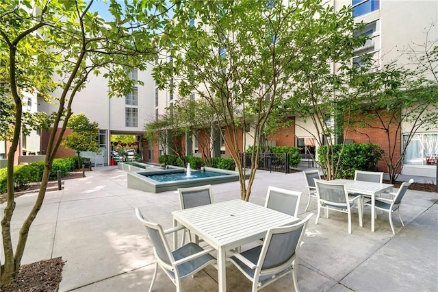 view of patio featuring outdoor dining area