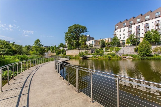 surrounding community featuring a water view