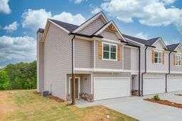 view of front of house with a garage and a front yard