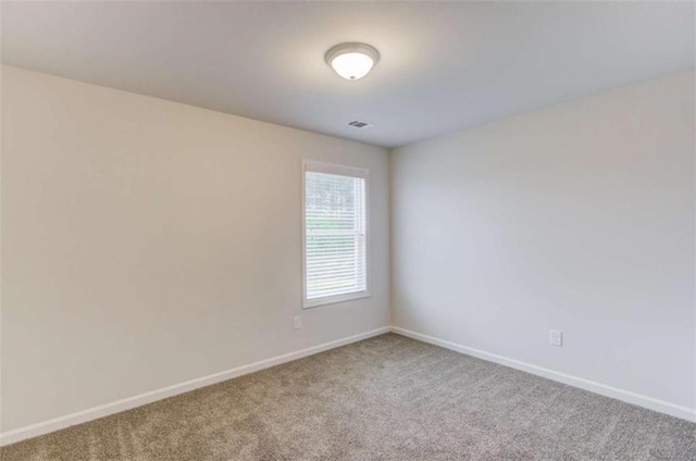 empty room featuring carpet flooring