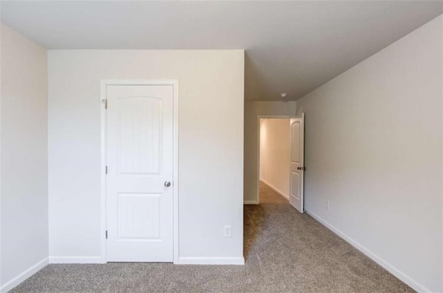 unfurnished bedroom with light carpet