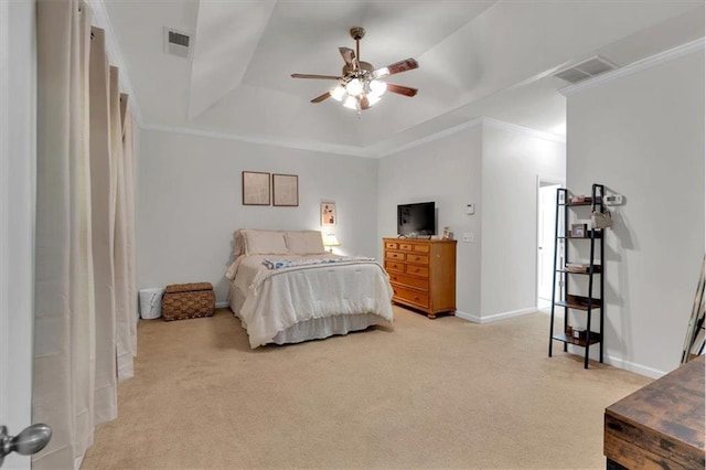 bedroom with light colored carpet, a tray ceiling, crown molding, baseboards, and a ceiling fan