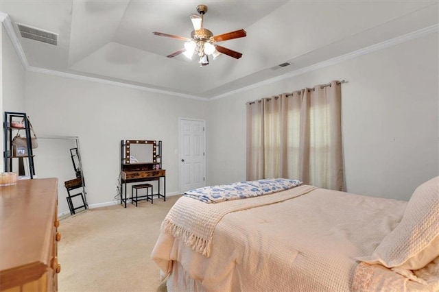 bedroom featuring a tray ceiling, carpet flooring, baseboards, and ornamental molding