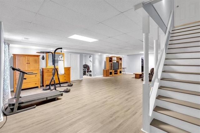 workout room with wood finished floors and baseboards