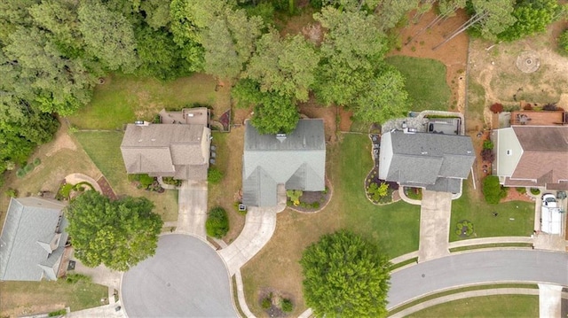 aerial view of property and surrounding area featuring nearby suburban area