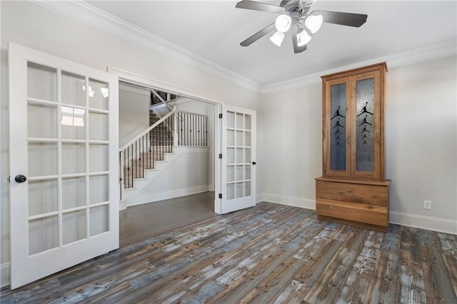 unfurnished room featuring dark hardwood / wood-style floors, ornamental molding, french doors, and ceiling fan