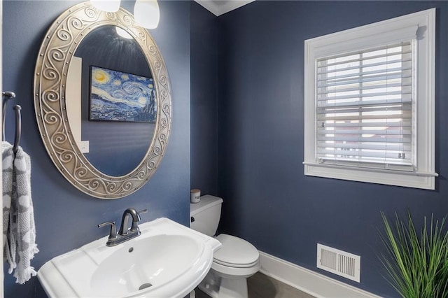 bathroom with sink and toilet