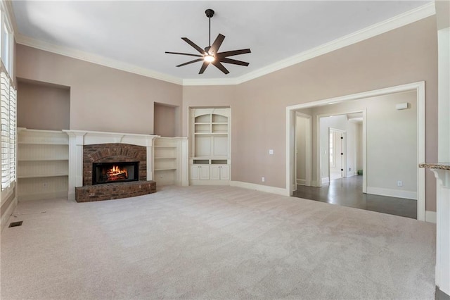 183 Applewood Ln, Acworth, GA 30101 - unfurnished living room featuring a ceiling fan, carpet, baseboards, built in features, and a brick fireplace