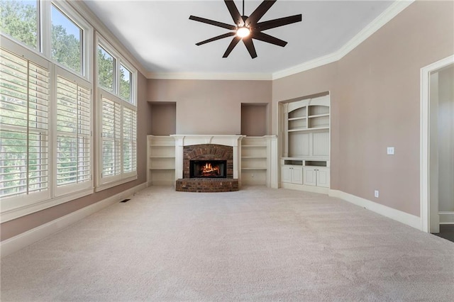 183 Applewood Ln, Acworth, GA 30101 - unfurnished living room featuring a ceiling fan, ornamental molding, baseboards, carpet, and a brick fireplace