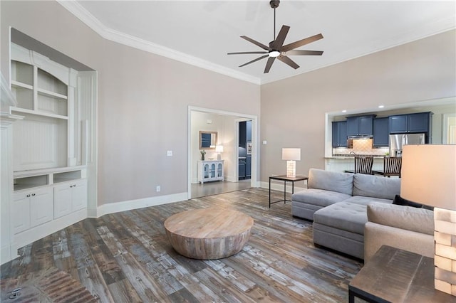 living room featuring ornamental molding, dark hardwood / wood-style floors, and ceiling fan