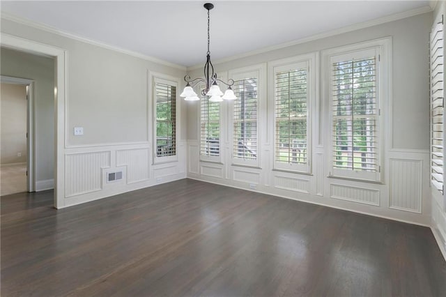 183 Applewood Ln, Acworth, GA 30101 - unfurnished dining area featuring a chandelier, healthy amount of natural light, dark wood finished floors, a decorative wall, and a wainscoted wall