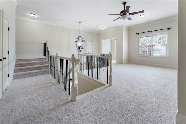 183 Applewood Ln, Acworth, GA 30101 - stairway with carpet floors, crown molding, baseboards, a ceiling fan, and a chandelier
